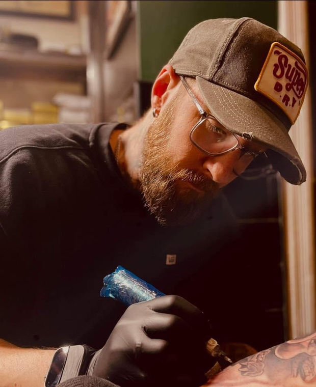 Danny (Daniel Watterson), owner and black and grey realism tattooist at Wotto's Ink